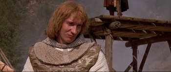 Movie still from “DragonHeart” (1996), directed by Rob Cohen – A person with long red hair; Close Up shot, Low angle