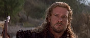 Movie still from “DragonHeart” (1996), directed by Rob Cohen – A person with long hair and a beard; Close Up shot, Low angle