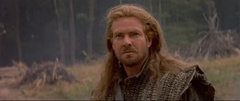 Movie still from “DragonHeart” (1996), directed by Rob Cohen – A person with long hair; Close Up shot, Over the shoulder angle