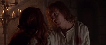 Movie still from “DragonHeart” (1996), directed by Rob Cohen – A man and a woman are looking at each other; Close Up shot, Over the shoulder angle