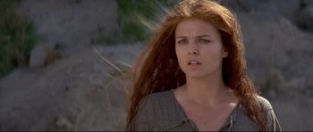 Movie still from “DragonHeart” (1996), directed by Rob Cohen – A person with long red hair; Close Up shot, Low angle