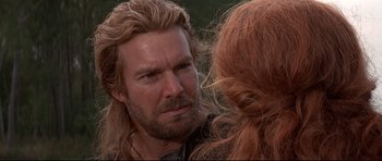 Movie still from “DragonHeart” (1996), directed by Rob Cohen – A person with long red hair; Close Up shot, Over the shoulder angle