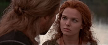 Movie still from “DragonHeart” (1996), directed by Rob Cohen – A man and a woman face to face in a scene; Close Up shot, Over the shoulder angle