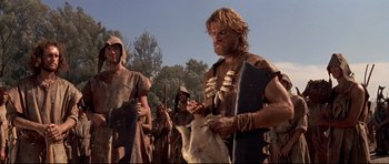 Movie still from “DragonHeart” (1996), directed by Rob Cohen – A group of men in the middle of a field; Medium shot, Low angle