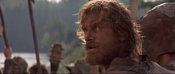 Movie still from “DragonHeart” (1996), directed by Rob Cohen – A person with long hair and a beard; Close Up shot, Low angle