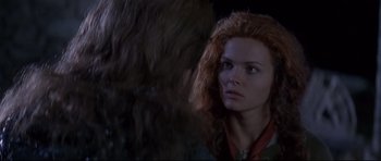 Movie still from “DragonHeart” (1996), directed by Rob Cohen – A person with long red hair; Close Up shot, Over the shoulder angle