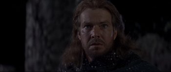 Movie still from “DragonHeart” (1996), directed by Rob Cohen – A person with long brown hair; Close Up shot, Over the shoulder angle