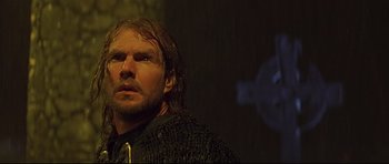 Movie still from “DragonHeart” (1996), directed by Rob Cohen – A person wearing a sweater; Close Up shot, Low angle