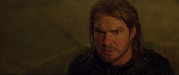 Movie still from “DragonHeart” (1996), directed by Rob Cohen – A person with wet hair; Close Up shot, Low angle