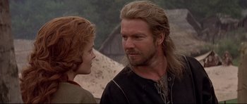 Movie still from “DragonHeart” (1996), directed by Rob Cohen – A man and a woman standing next to each other; Close Up shot, Over the shoulder angle