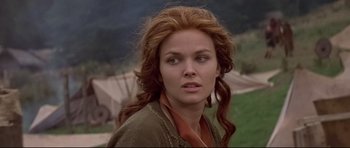 Movie still from “DragonHeart” (1996), directed by Rob Cohen – A person with long red hair; Close Up shot, Over the shoulder angle