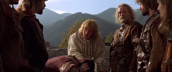 Movie still from “DragonHeart” (1996), directed by Rob Cohen – A man and a woman in medieval garb standing next to each other; Medium shot, Low angle