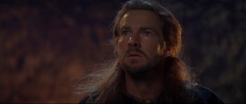 Movie still from “DragonHeart” (1996), directed by Rob Cohen – A person with long hair; Close Up shot, Low angle