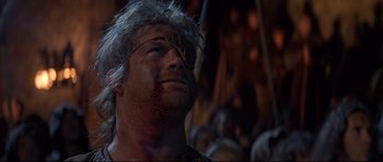 Movie still from “DragonHeart” (1996), directed by Rob Cohen – A person with a face paint; Close Up shot, Low angle