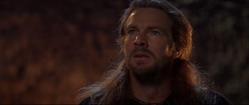 Movie still from “DragonHeart” (1996), directed by Rob Cohen – A person with long hair; Close Up shot, Low angle
