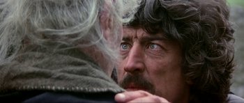 Movie still from “Dragonslayer” (1981), directed by Matthew Robbins – An older man looking at another older man with blue eyes; Close Up shot, Over the shoulder angle