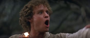 Movie still from “Dragonslayer” (1981), directed by Matthew Robbins – A man with a surprised look on his face; Close Up shot, Low angle