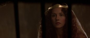 Movie still from “Dragonslayer” (1981), directed by Matthew Robbins – A person wearing a crown; Close Up shot, Over the shoulder angle