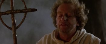 Movie still from “Dragonslayer” (1981), directed by Matthew Robbins – A person with a knife; Close Up shot, Low angle