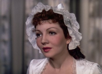 Movie still from “Drums Along the Mohawk” (1939), directed by John Ford – A person wearing a hat; Close Up shot, Over the shoulder angle