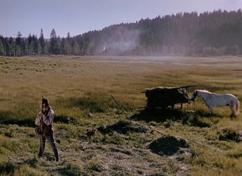 Movie still from “Drums Along the Mohawk” (1939), directed by John Ford – A man standing in the middle of an open field; Extreme Wide shot, High angle