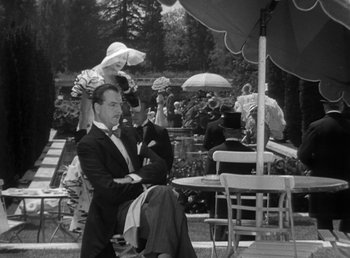 Movie still from “Duck Soup” (1933), directed by Leo McCarey – A black and white photo of a man in a tuxedo; Wide shot, High angle