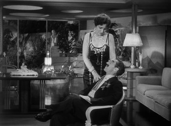 Movie still from “Duck Soup” (1933), directed by Leo McCarey – A man and a woman sitting in a living room; Medium shot, High angle