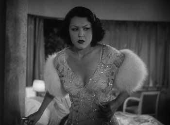 Movie still from “Duck Soup” (1933), directed by Leo McCarey – A black - and - white photo of a woman in a dress; Medium shot, Low angle