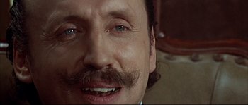 Movie still from “Duck, You Sucker!” (1971), directed by Sergio Leone – A person with a mustache; Close Up shot, Low angle