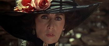 Movie still from “Duck, You Sucker!” (1971), directed by Sergio Leone – A person wearing a hat; Close Up shot, Over the shoulder angle