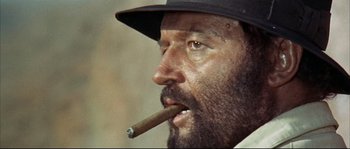 Movie still from “Duck, You Sucker!” (1971), directed by Sergio Leone – A person with a cigar in his mouth; Close Up shot, Low angle