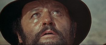 Movie still from “Duck, You Sucker!” (1971), directed by Sergio Leone – A man's face with a beard; Close Up shot, Low angle