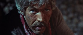 Movie still from “Duck, You Sucker!” (1971), directed by Sergio Leone – A person wearing a bandana; Close Up shot, Low angle