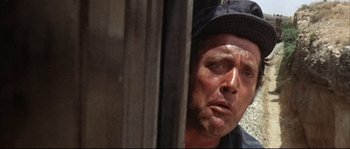 Movie still from “Duck, You Sucker!” (1971), directed by Sergio Leone – A person with a hat on; Close Up shot, Low angle
