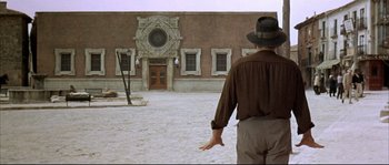 Movie still from “Duck, You Sucker!” (1971), directed by Sergio Leone – A man standing in front of an old building; Wide shot, Low angle