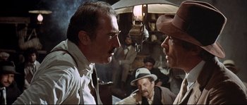 Movie still from “Duck, You Sucker!” (1971), directed by Sergio Leone – A man and a woman are talking to each other; Close Up shot, Over the shoulder angle