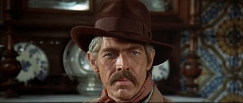 Movie still from “Duck, You Sucker!” (1971), directed by Sergio Leone – A person wearing a hat; Close Up shot, Low angle