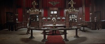 Movie still from “Duck, You Sucker!” (1971), directed by Sergio Leone – A room with many tables and chairs in it; Extreme Wide shot, High angle