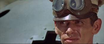 Movie still from “Duck, You Sucker!” (1971), directed by Sergio Leone – A person wearing goggles and a hat; Close Up shot, Low angle