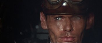 Movie still from “Duck, You Sucker!” (1971), directed by Sergio Leone – A man wearing a helmet and goggles; Close Up shot, High angle