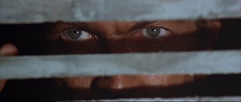 Movie still from “Duck, You Sucker!” (1971), directed by Sergio Leone – The eyes of a man with a bandage covering his face; Extreme Close Up shot, Overhead angle
