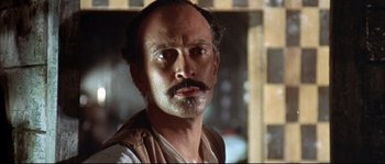 Movie still from “Duck, You Sucker!” (1971), directed by Sergio Leone – A person with a mustache; Close Up shot, Low angle