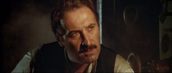 Movie still from “Duck, You Sucker!” (1971), directed by Sergio Leone – A person with a mustache; Close Up shot, Low angle
