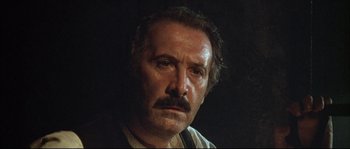Movie still from “Duck, You Sucker!” (1971), directed by Sergio Leone – A person with a mustache; Close Up shot, Low angle