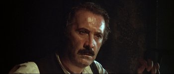 Movie still from “Duck, You Sucker!” (1971), directed by Sergio Leone – A person with a mustache; Close Up shot, Low angle