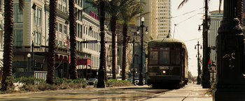 Movie still from “Deja Vu” (2006), directed by Tony Scott – A train on the tracks in a city; Extreme Wide shot, High angle