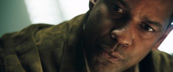 Movie still from “Deja Vu” (2006), directed by Tony Scott – View of a man's face; Extreme Close Up shot, Low angle