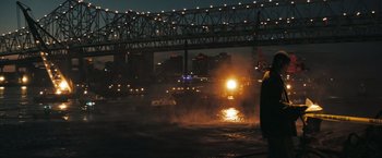Movie still from “Deja Vu” (2006), directed by Tony Scott – A fire truck on a fire hydrant in the middle of the night; Extreme Wide shot, Over the shoulder angle