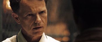 Movie still from “Deja Vu” (2006), directed by Tony Scott – A person wearing a white dress shirt; Close Up shot, Over the shoulder angle