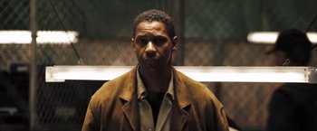 Movie still from “Deja Vu” (2006), directed by Tony Scott – A man in a brown jacket is looking at the camera; Close Up shot, Low angle